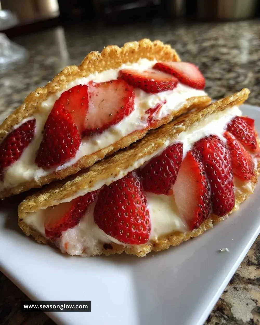 Delicious strawberry cheesecake tacos served on a plate