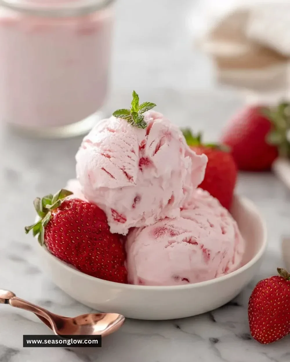 Delicious strawberry cottage cheese ice cream topped with fresh strawberries