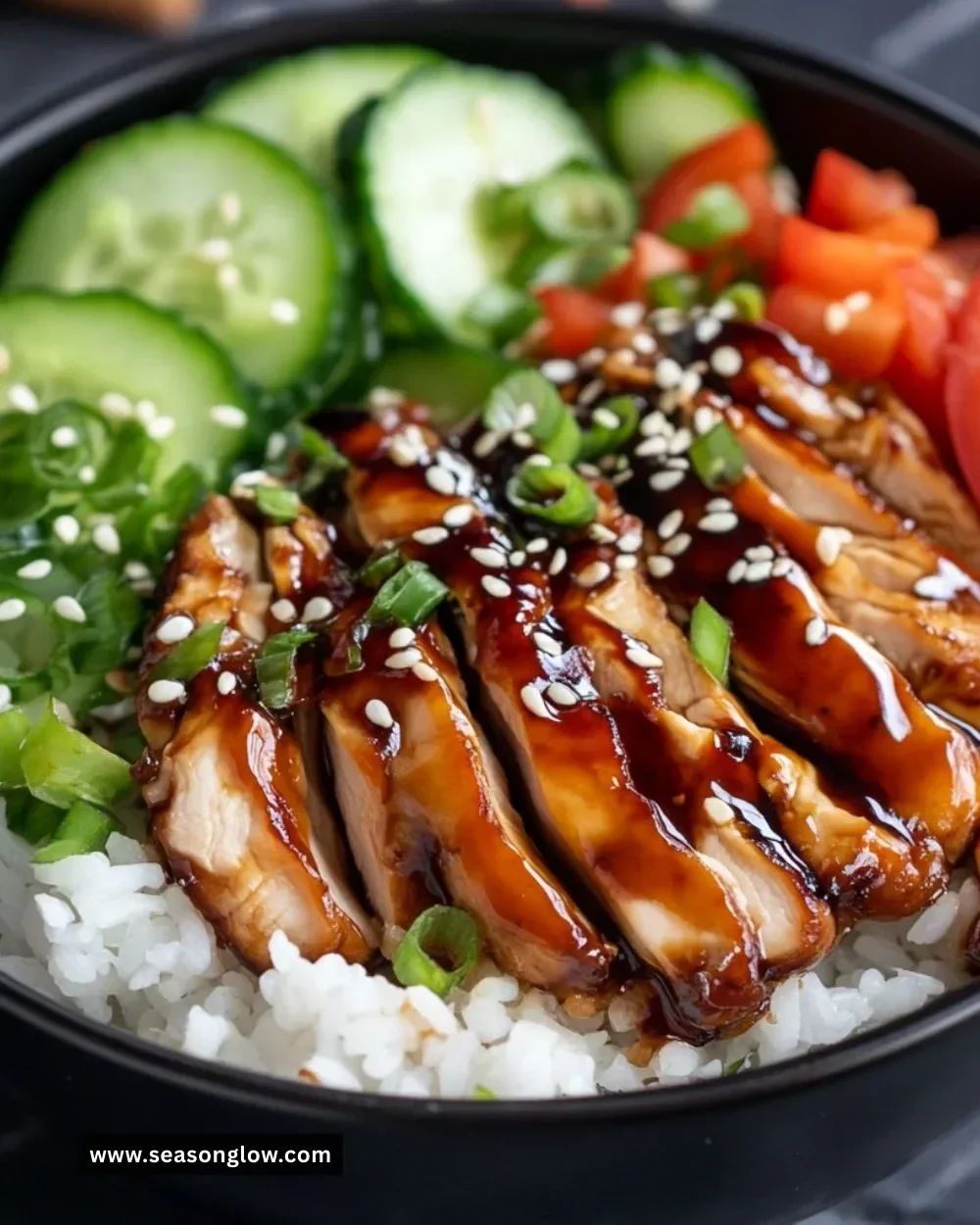 Teriyaki chicken rice bowl with fresh vegetables and savory sauce