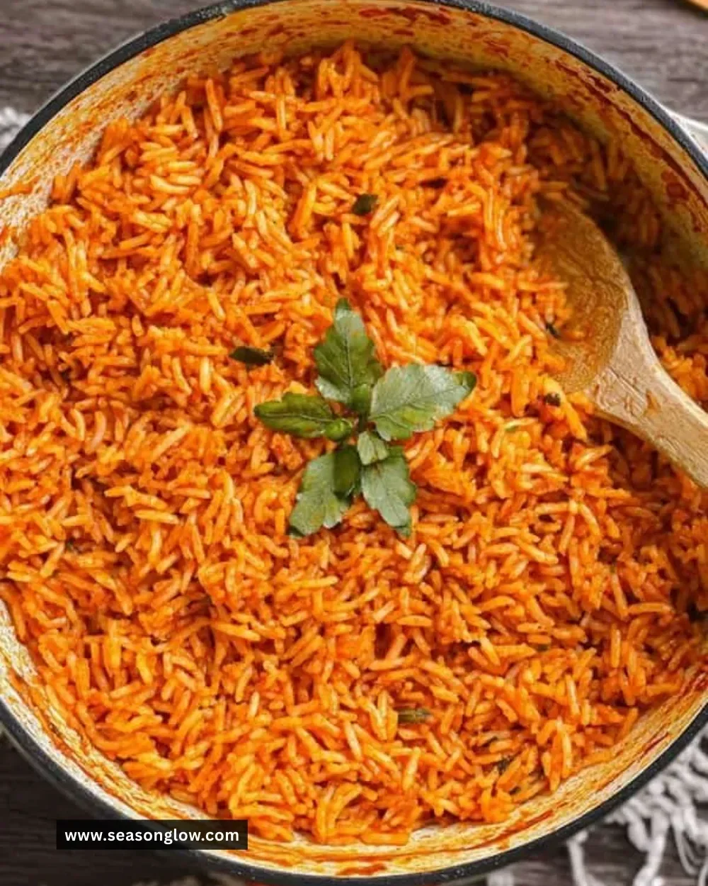 A plate of delicious jollof rice topped with fresh vegetables.