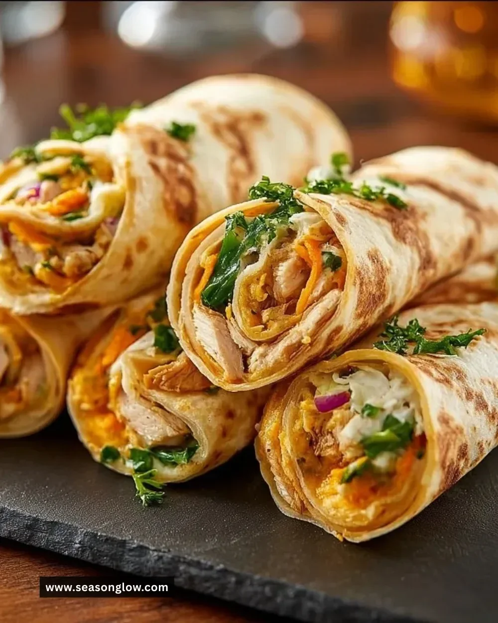 Colorful tortilla roll-ups filled with veggies and cream cheese for a tasty snack.