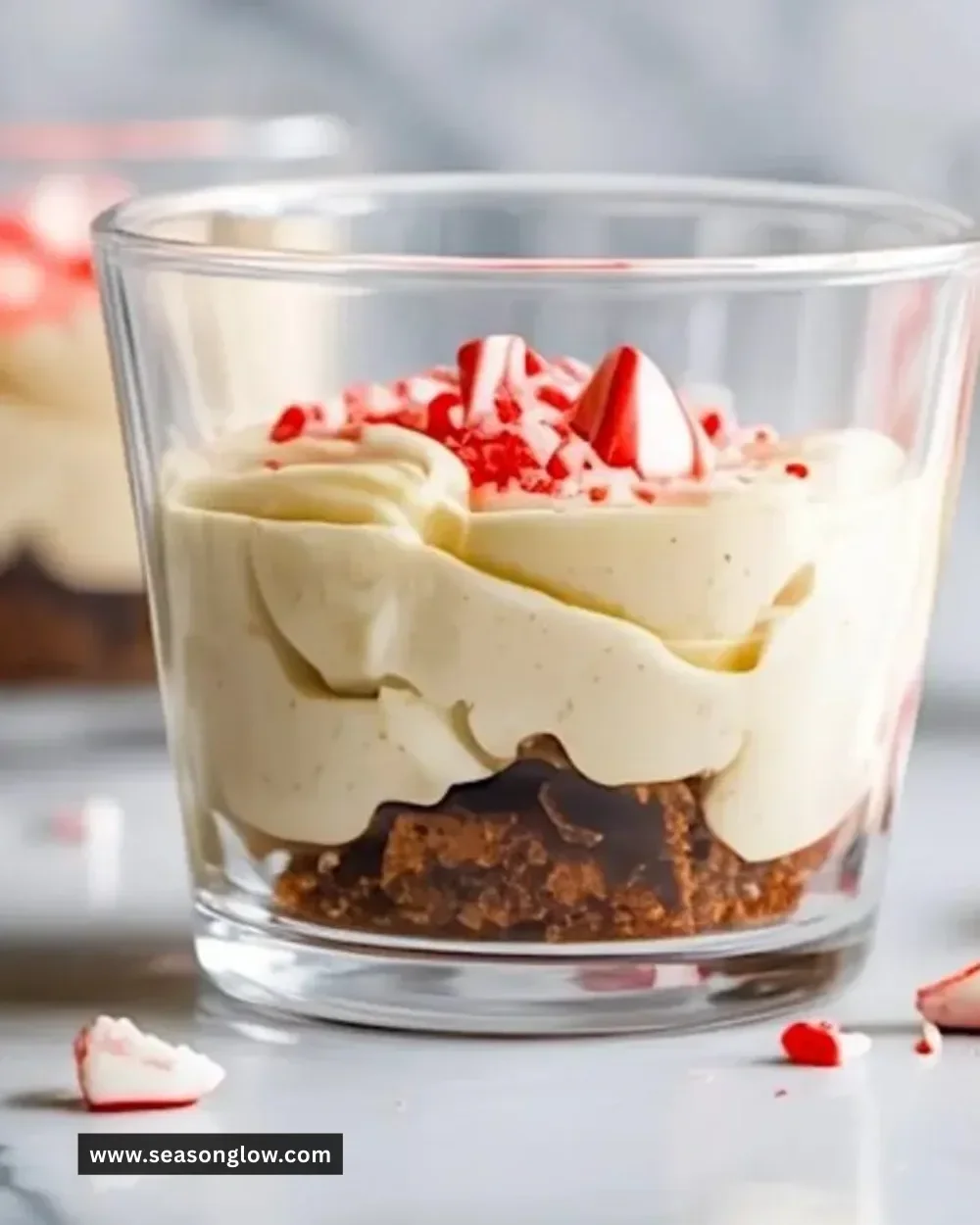 Delicious white chocolate peppermint bark mousse topping with crushed peppermint candy.
