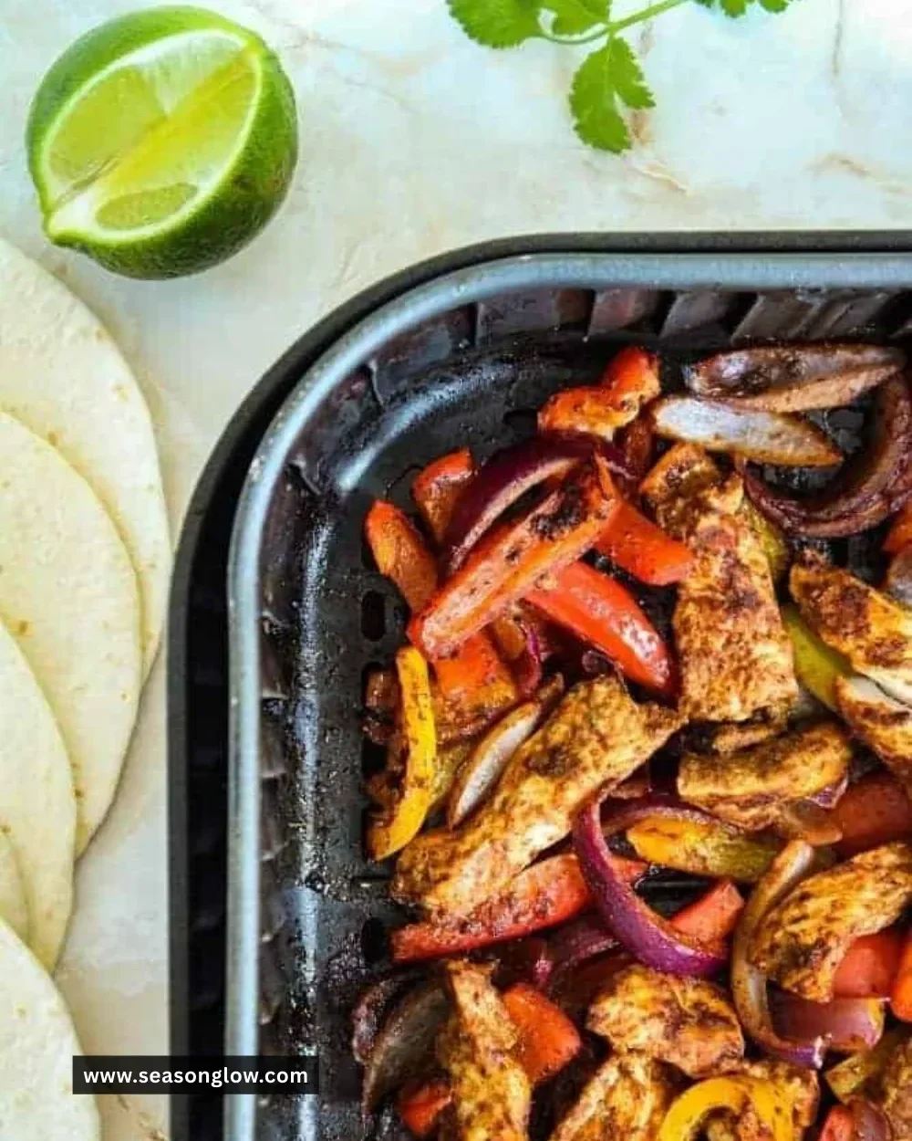 Delicious air fryer chicken fajitas served with peppers and onions