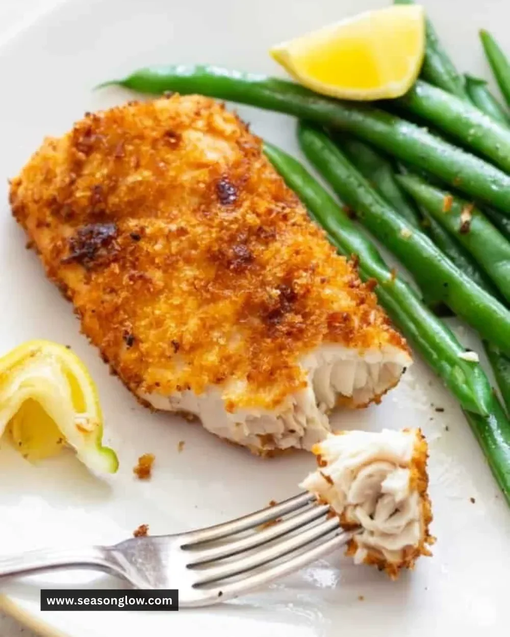 Delicious Air Fryer Mahi Mahi served with lemon and herbs