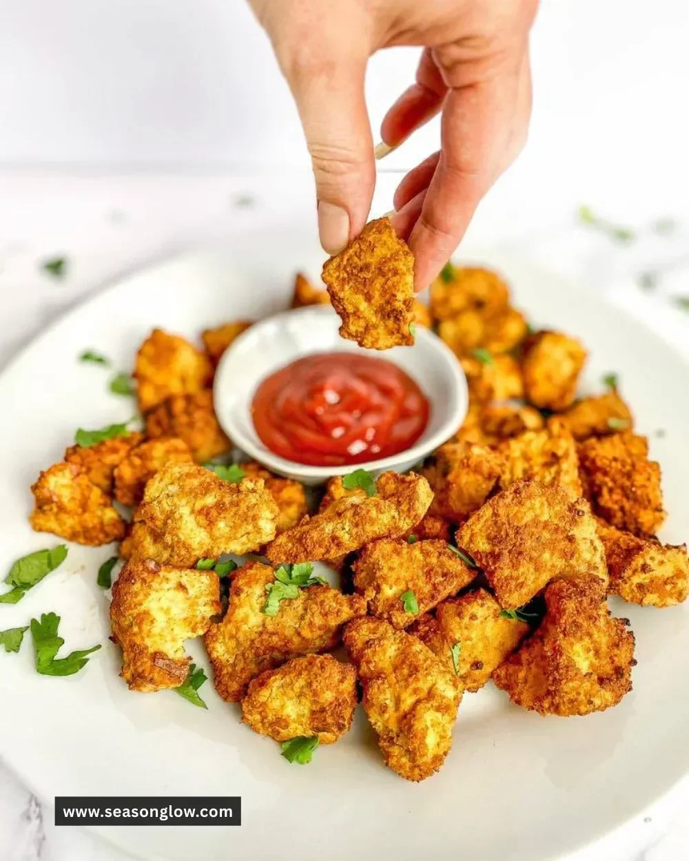 Air fryer tofu nuggets served in a bowl, crispy and oil-free vegan snack