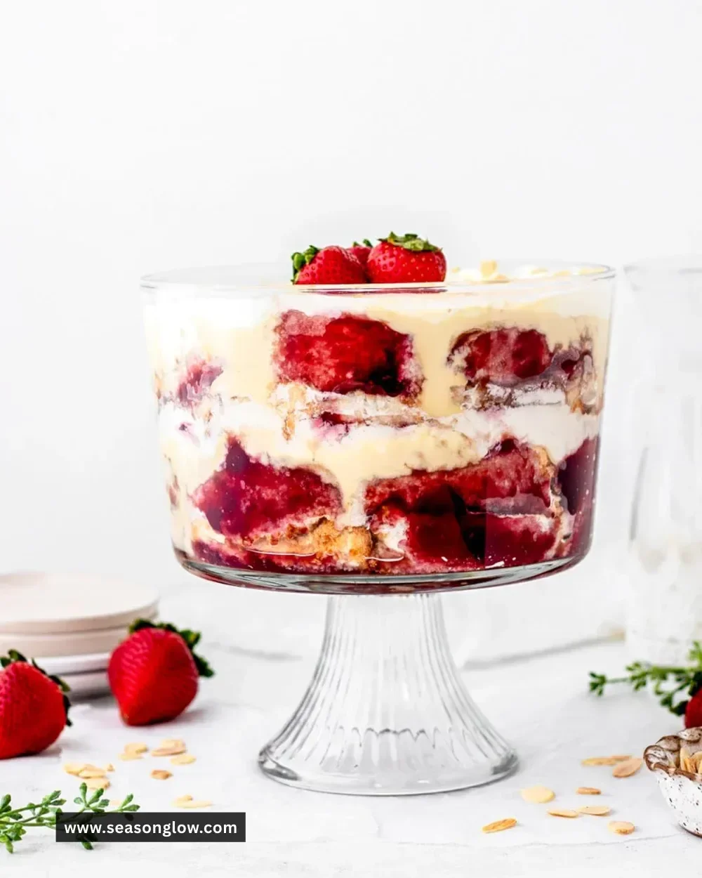 Delicious English trifle with layers of fruit, custard, and whipped cream