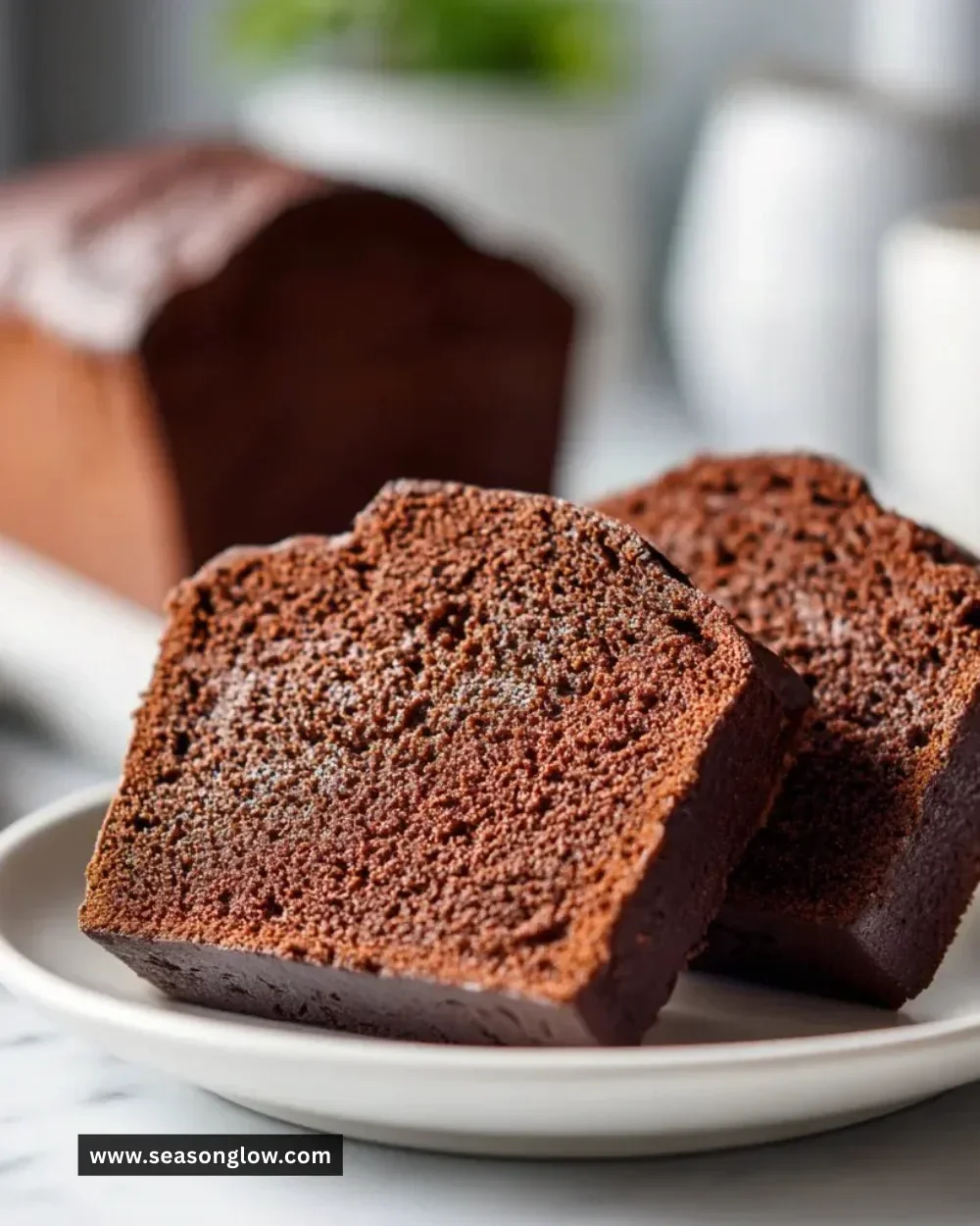 Delicious buttermilk chocolate pound cake displayed on a rustic wooden table