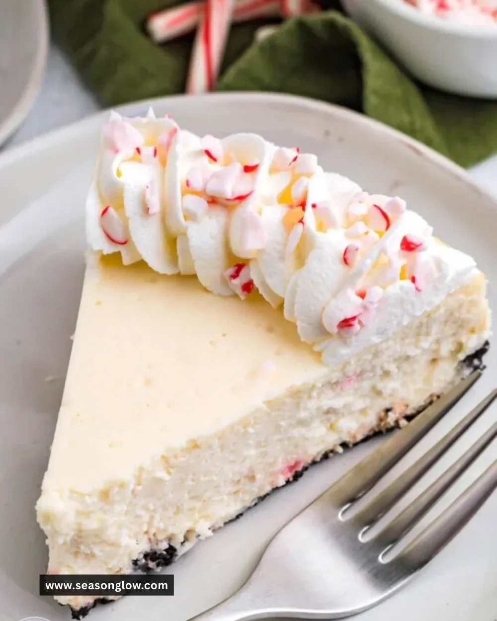 Delicious Candy Cane Cheesecake topped with crushed candy canes for a festive touch.