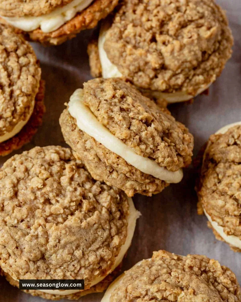 Chai Oatmeal Cream Pies with spices and cream filling on a rustic table.