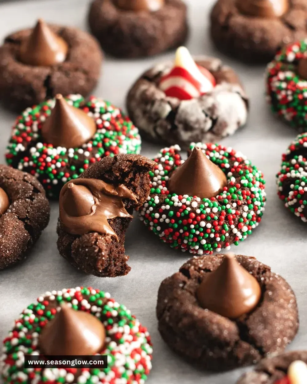 Freshly baked Chocolate Blossom Cookies on a cooling rack with a chocolate center