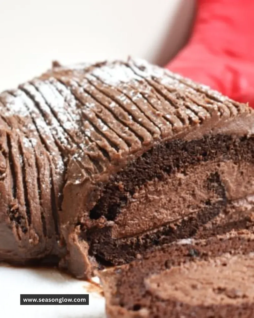 Delicious Chocolate Yule Log Cheesecake decorated for the holidays