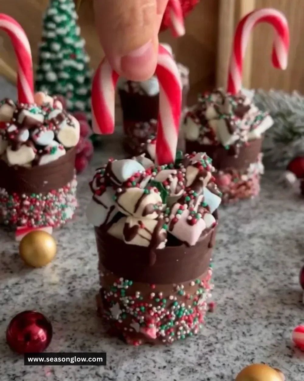 A cozy cup of Christmas chocolate hot cups topped with whipped cream.