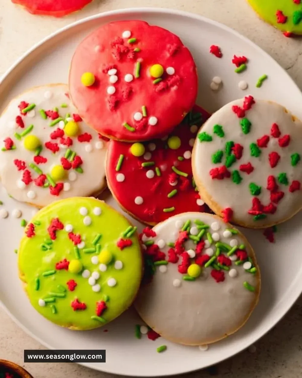 Decoratively shaped Christmas cut-out shortbread cookies on a festive plate