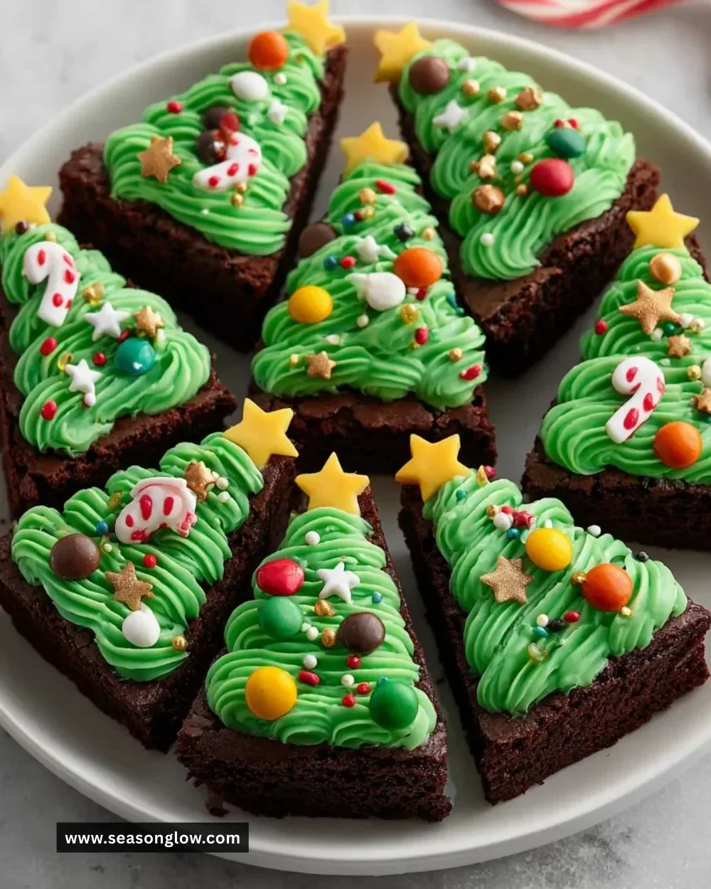 Festive Christmas Tree Brownie Bites decorated with colorful icing and sprinkles