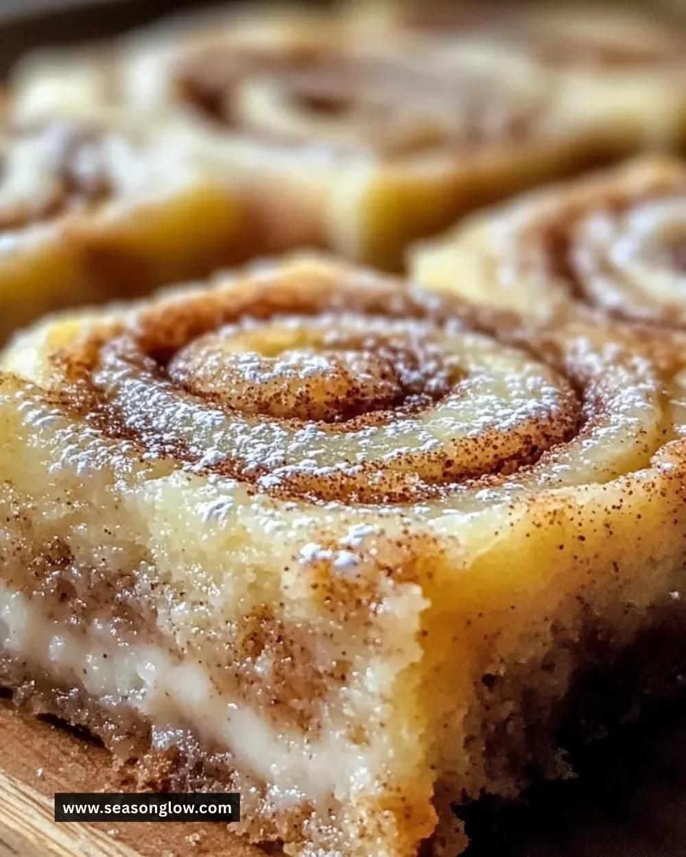 Delicious Cinnamon Roll Bliss Bars topped with sweet icing, ideal for dessert.