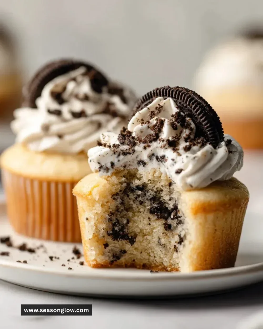 Delicious Cookies and Cream Cupcakes topped with cookie crumbles and cream frosting