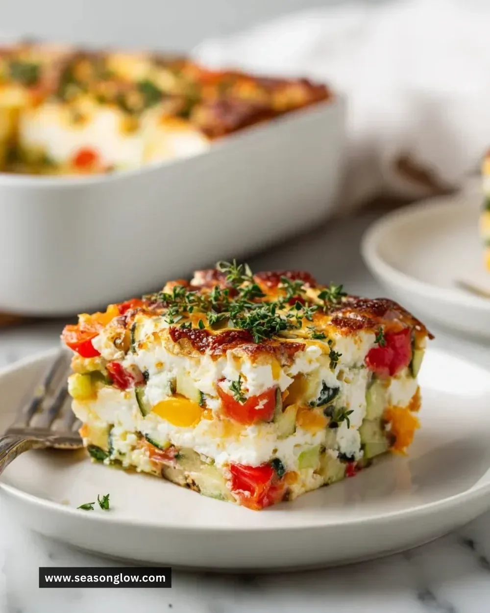 Cottage cheese and veggie bake fresh out of the oven, served in a dish.