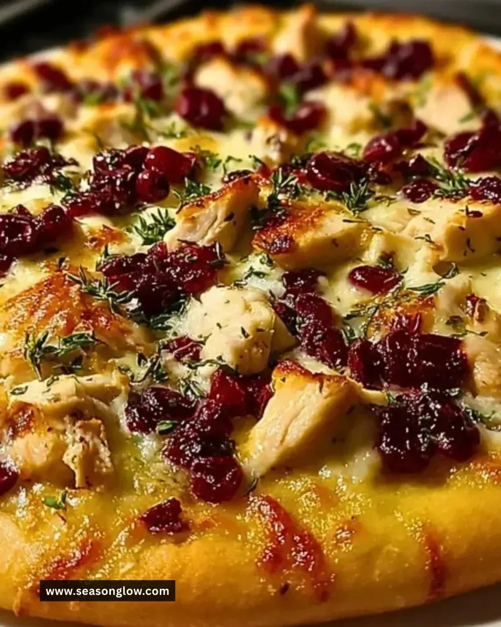 Cranberry Chicken & Brie Pizza with savory toppings on a fresh crust