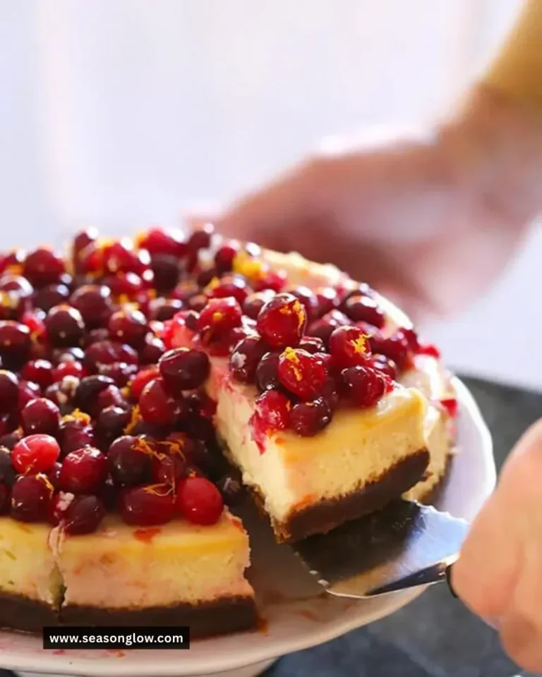 Delicious Cranberry Orange Cheesecake with fresh cranberries and orange slices