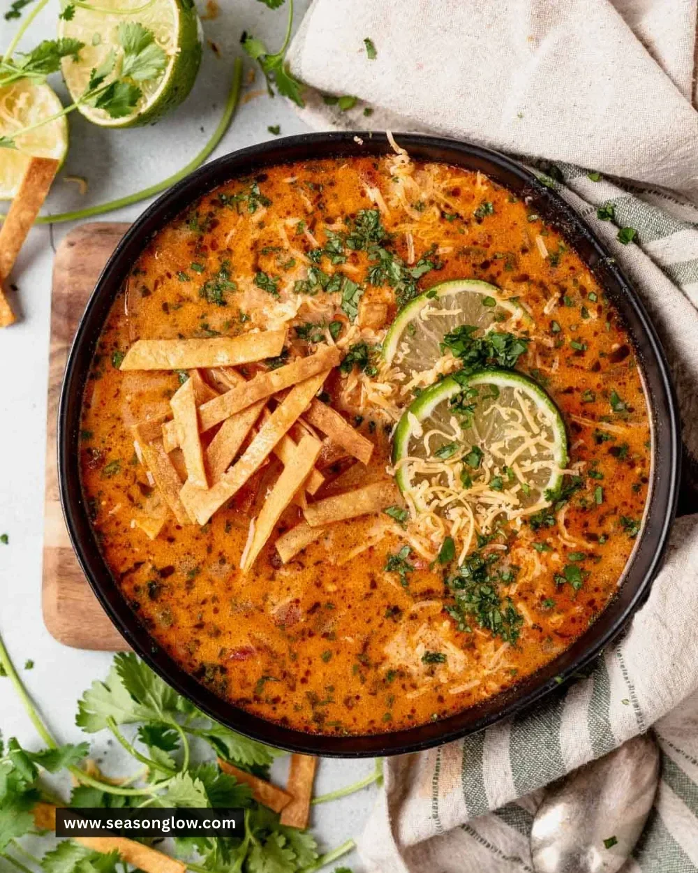 Creamy Chicken Tortilla Soup garnished with tortilla strips and fresh cilantro