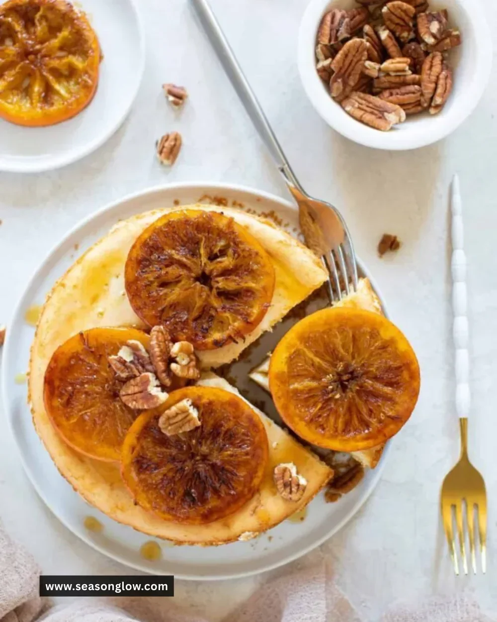 Creamy spiced orange cheesecake topped with zest and spices.