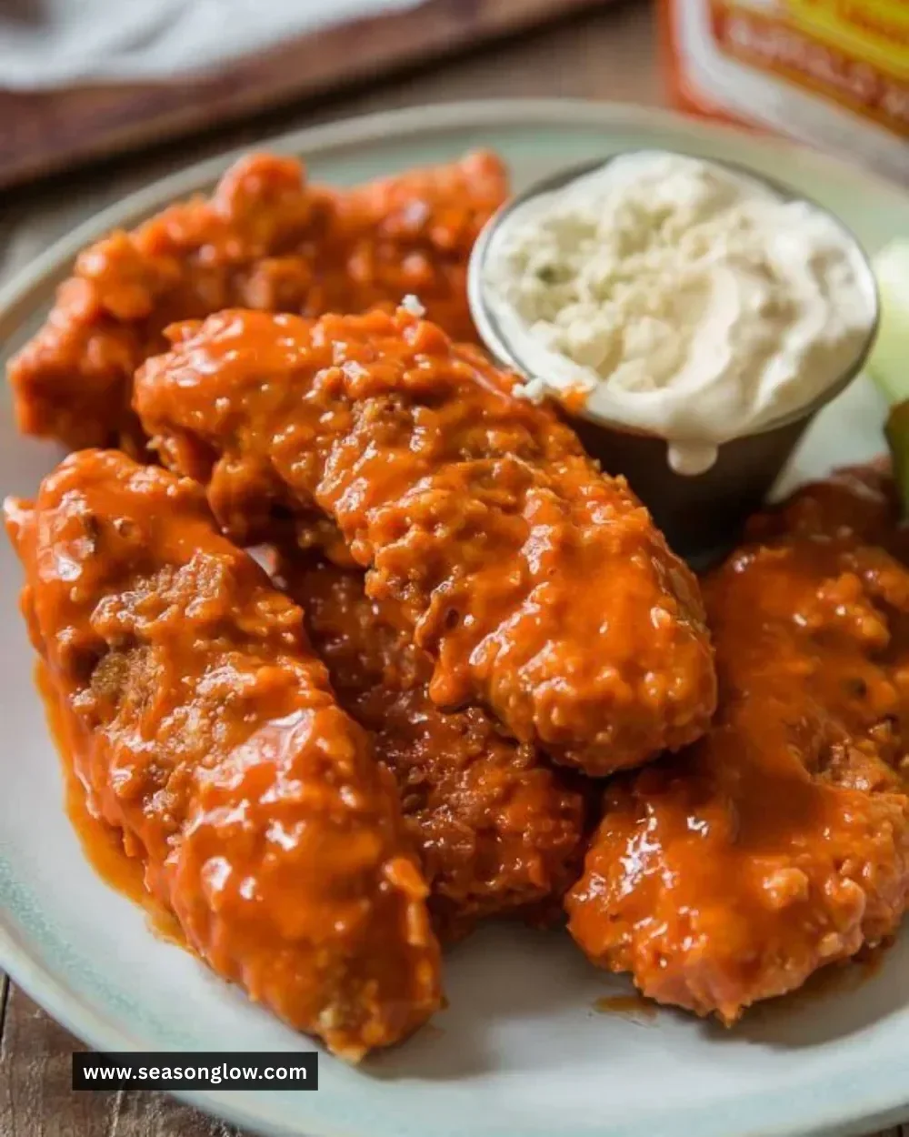 Crispy baked Buffalo chicken fingers served with dipping sauce.