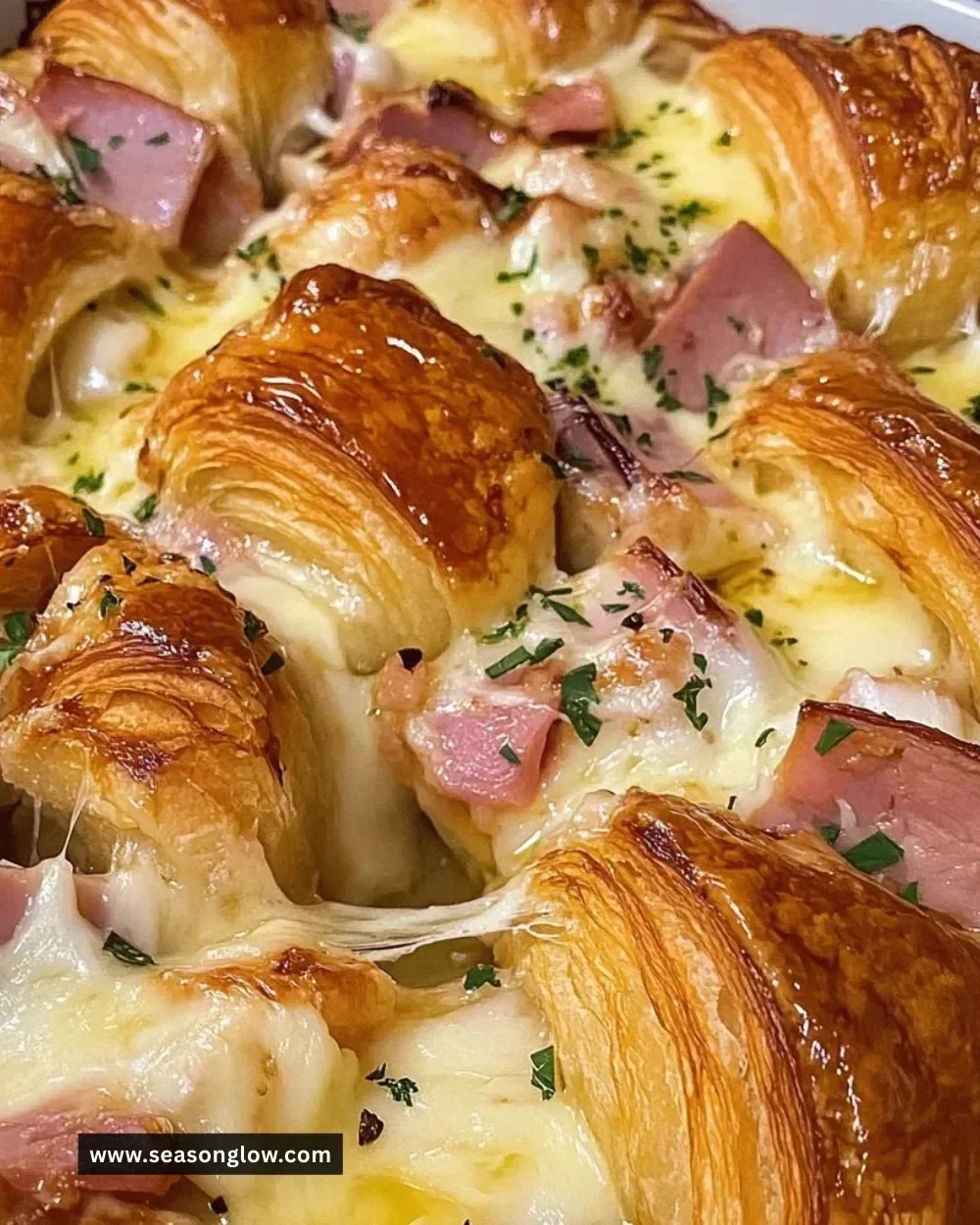 Freshly baked croissants stacked on a plate, ready to enjoy.