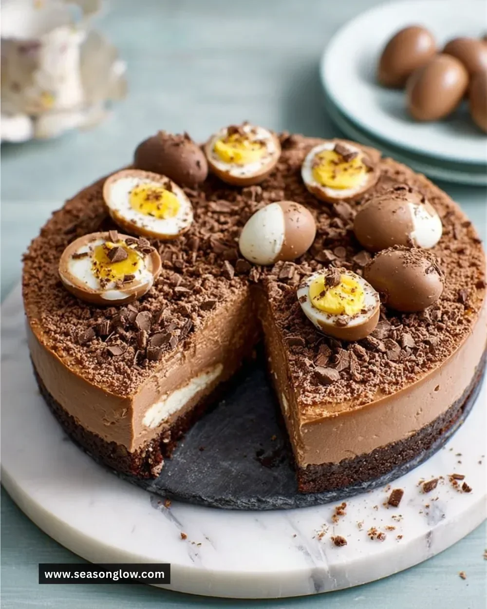 Delicious Double Chocolate Easter Egg Cheesecake topped with chocolate eggs