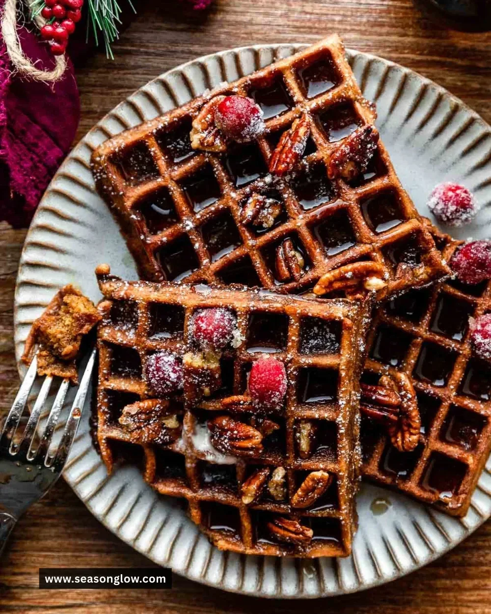 Plate of easy gingerbread waffles with syrup and whipped cream
