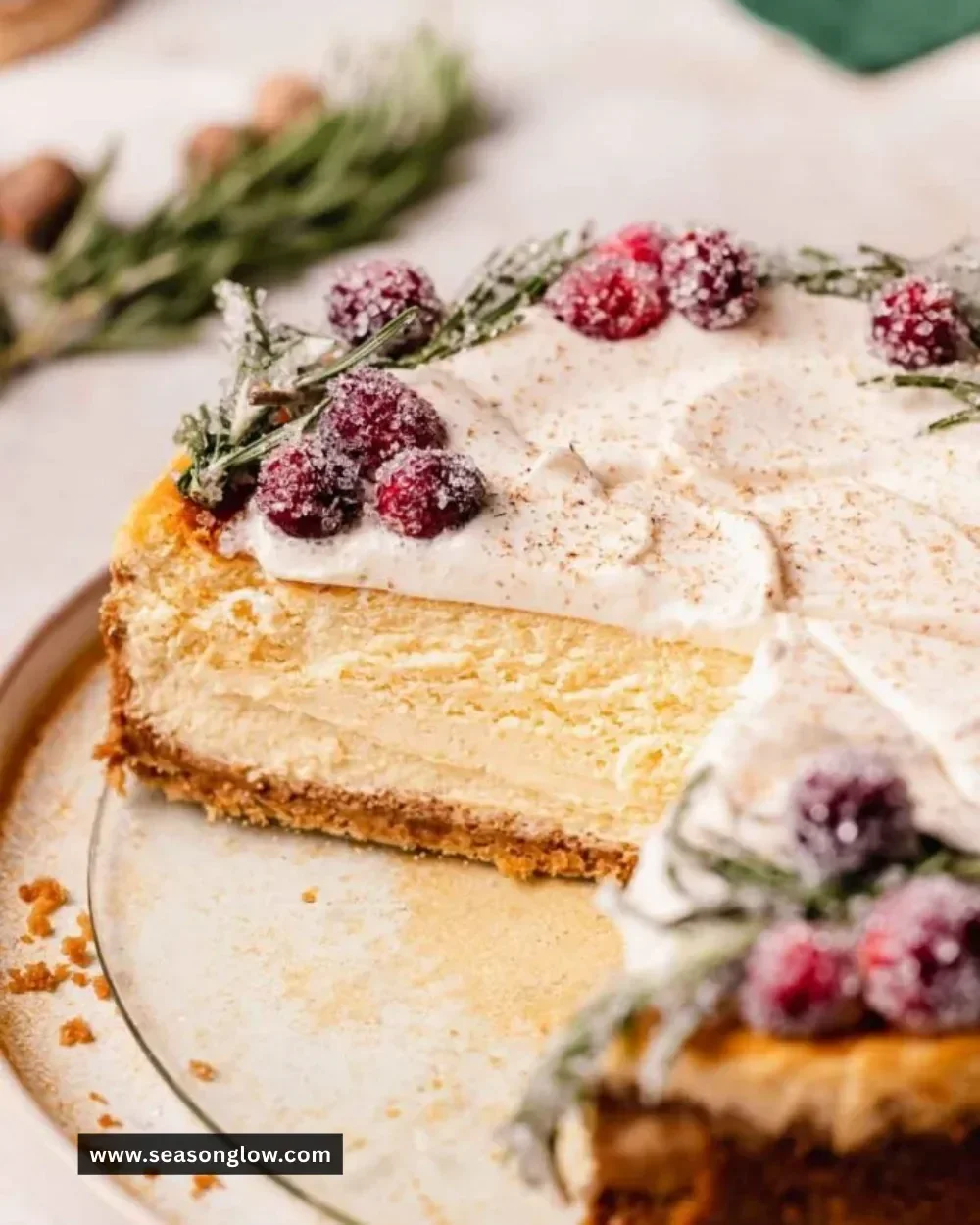 Slice of creamy Eggnog Cheesecake topped with whipped cream and nutmeg