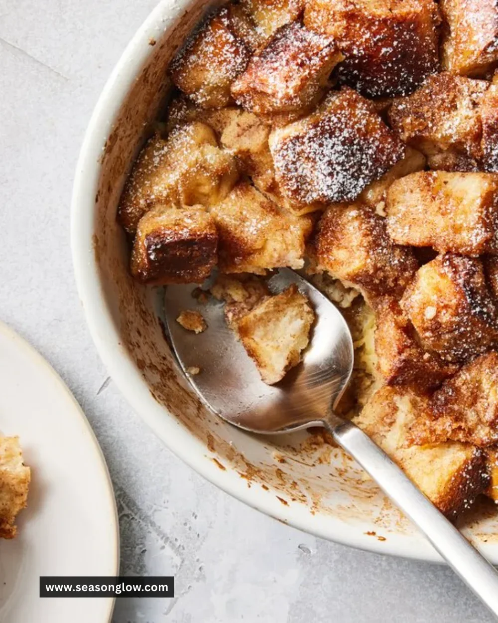 Delicious baked French Toast Casserole served with syrup and berries