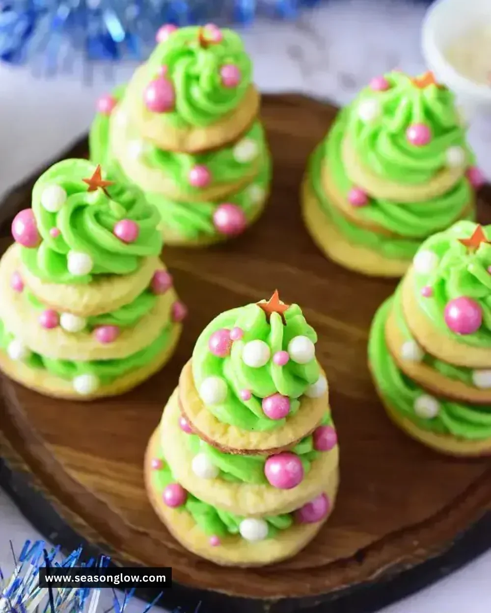 Delicious frosted Christmas tree cookies decorated for the holiday season.