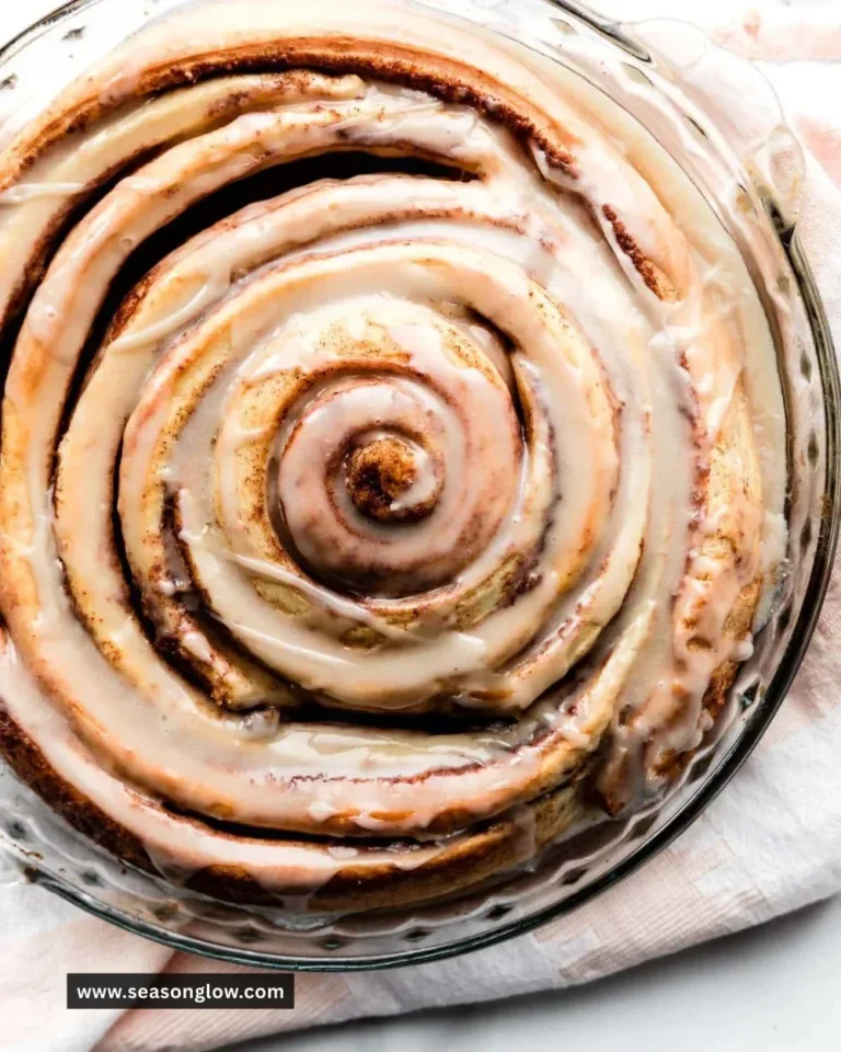 Delicious giant cinnamon roll cake on a serving plate