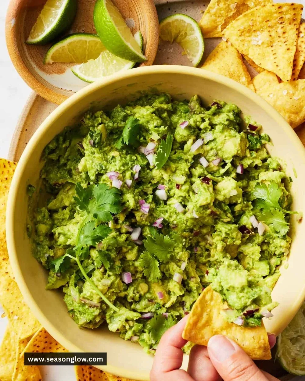 Freshly made guacamole served with tortilla chips and toppings