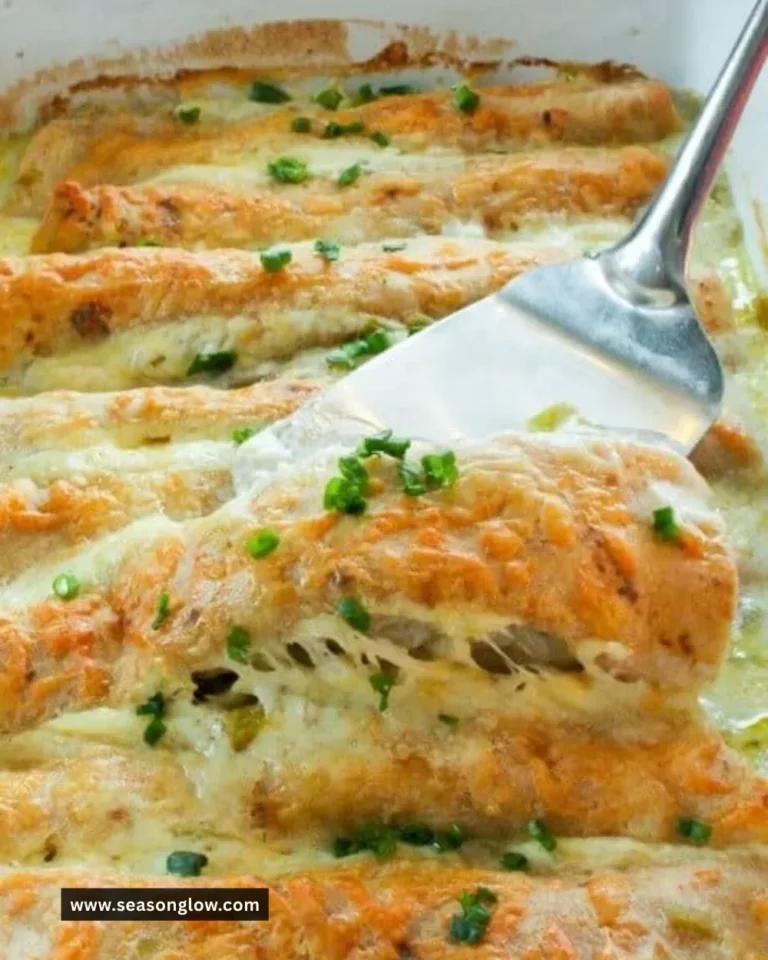 Healthy white chicken enchiladas topped with creamy sauce and garnished with cilantro