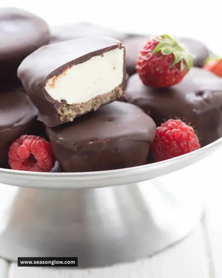 Keto Cheesecake Bites on a white plate garnished with berries