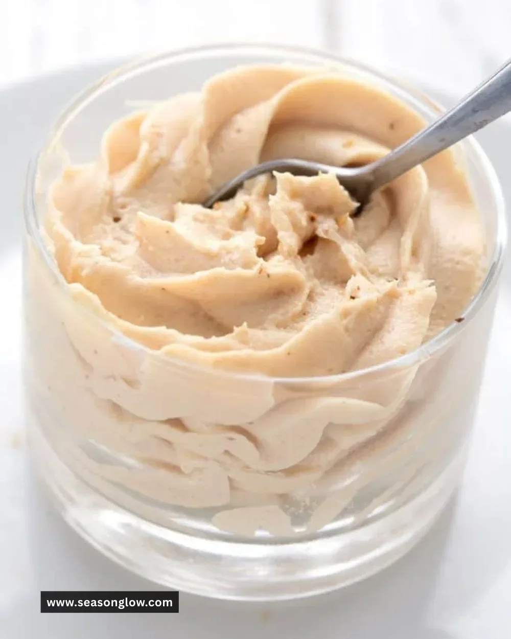 Delicious Keto Peanut Butter Mousse in a bowl garnished with nuts