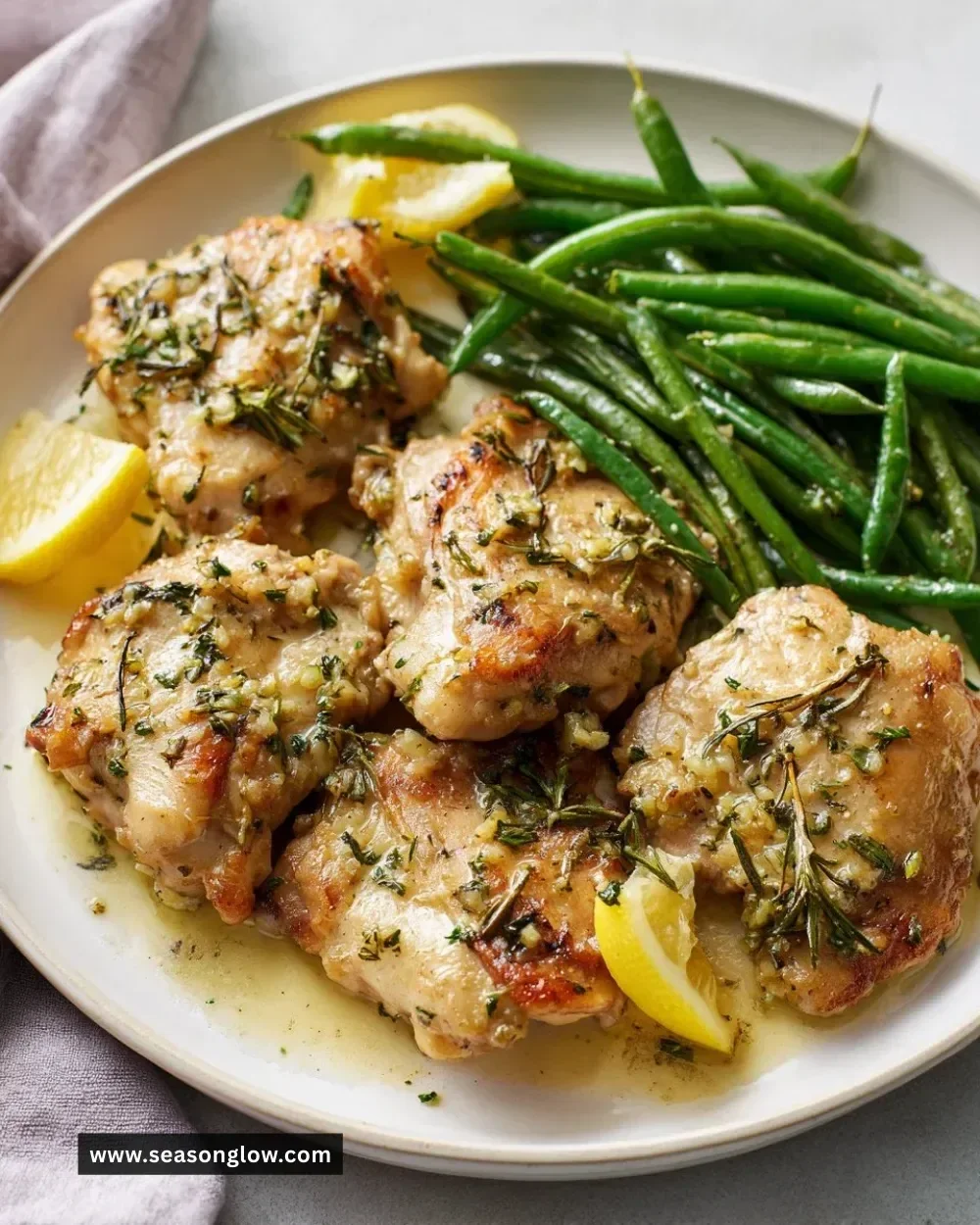 Lemon Garlic Butter Chicken served with Green Beans in a skillet
