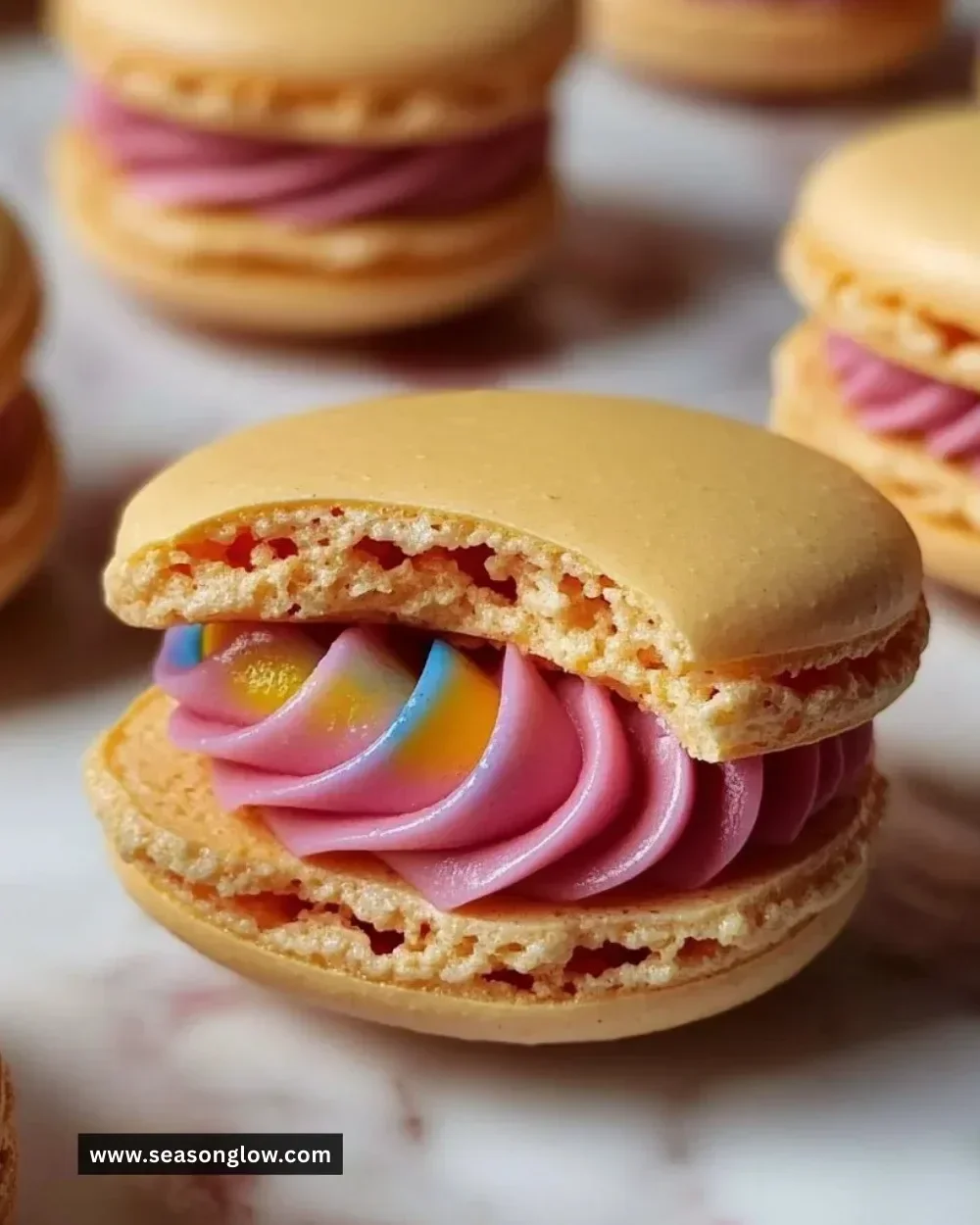 Simple macaron recipe for beginners with colorful finished cookies on a baking tray.