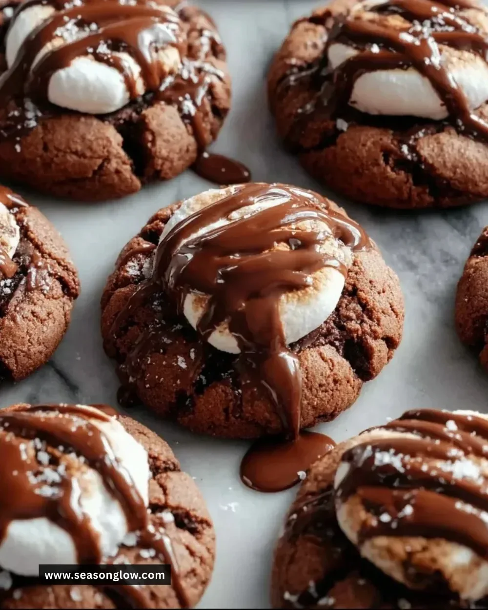Delicious marshmallow-surprise hot cocoa cookies on a cooling rack.