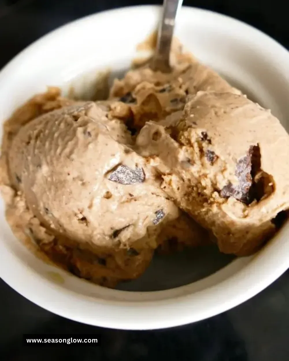 Bowl of Ninja Creami Chickpea Ice Cream topped with nuts and chocolate chips
