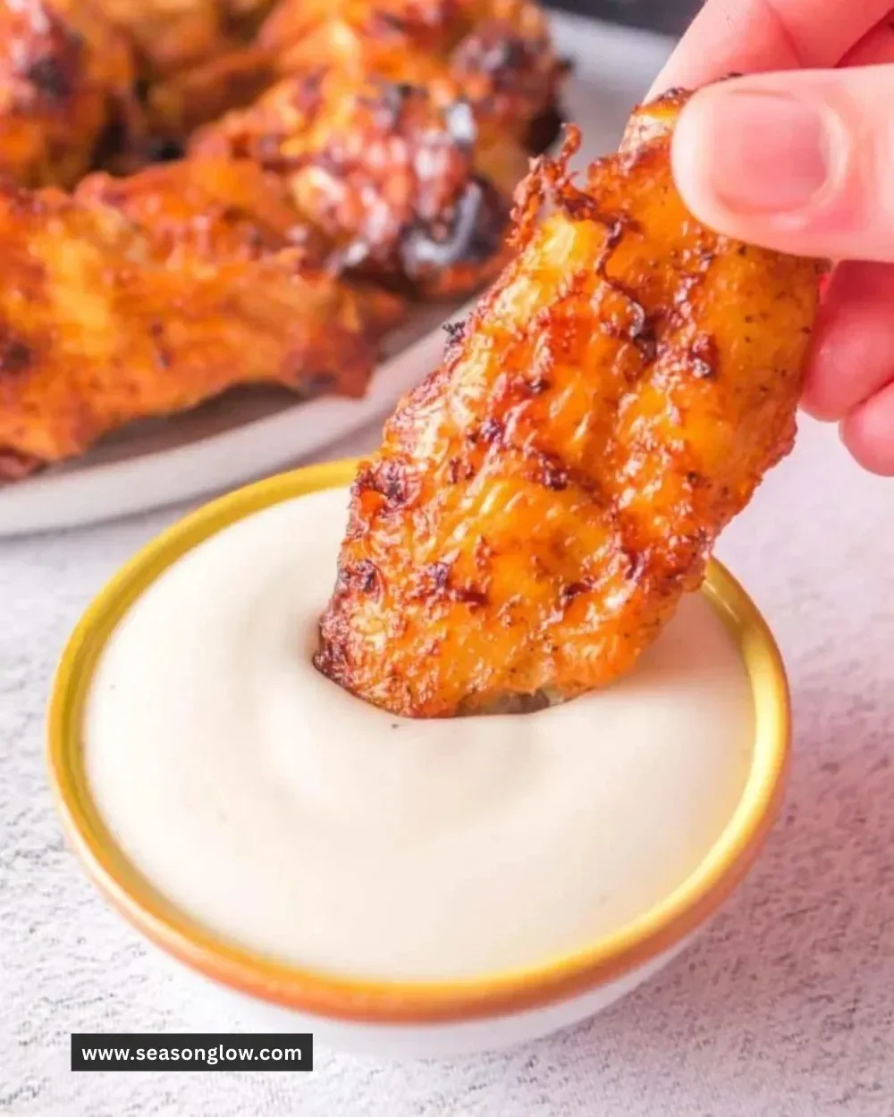 Crispy Ninja Foodi chicken wings served with dipping sauce