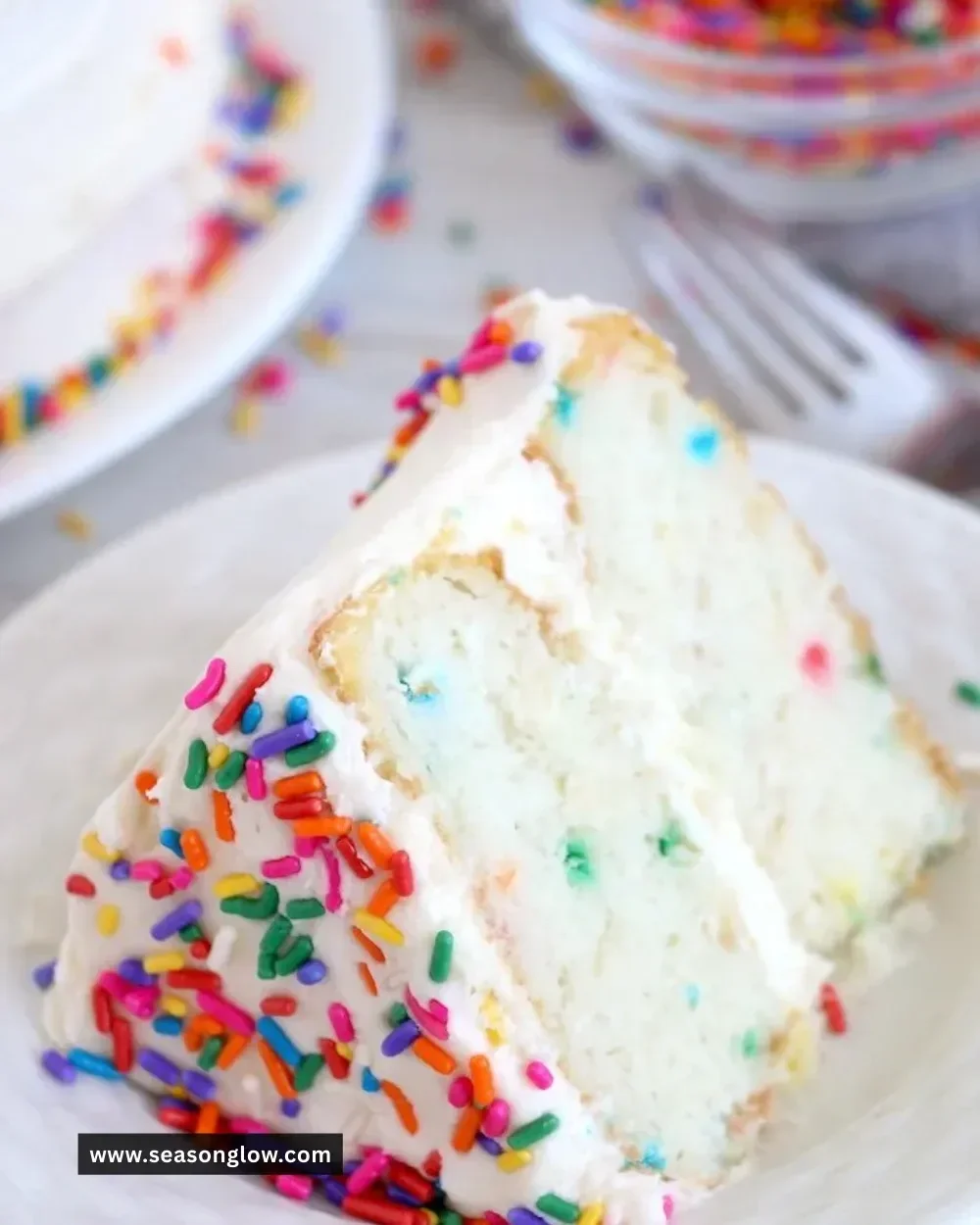 Ninja Foodi Confetti Cake decorated with colorful sprinkles and icing