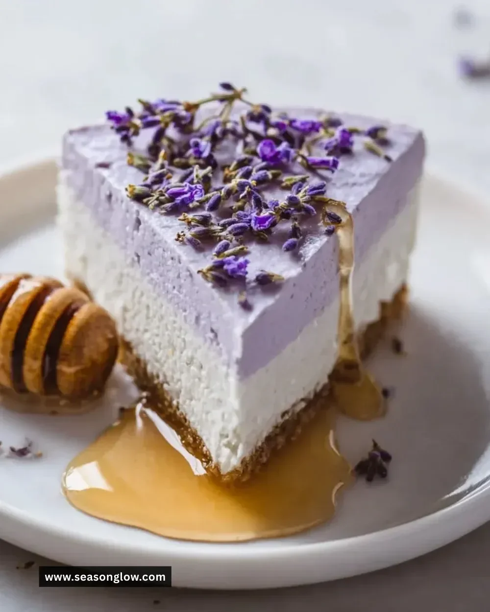 No Bake Honey Lavender Cheesecake topped with lavender flowers and honey drizzle.