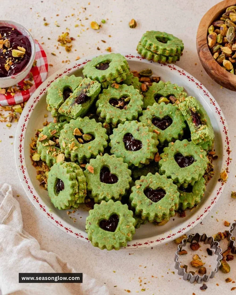 Pistachio Linzer cookies with a nutty filling and delicate texture.