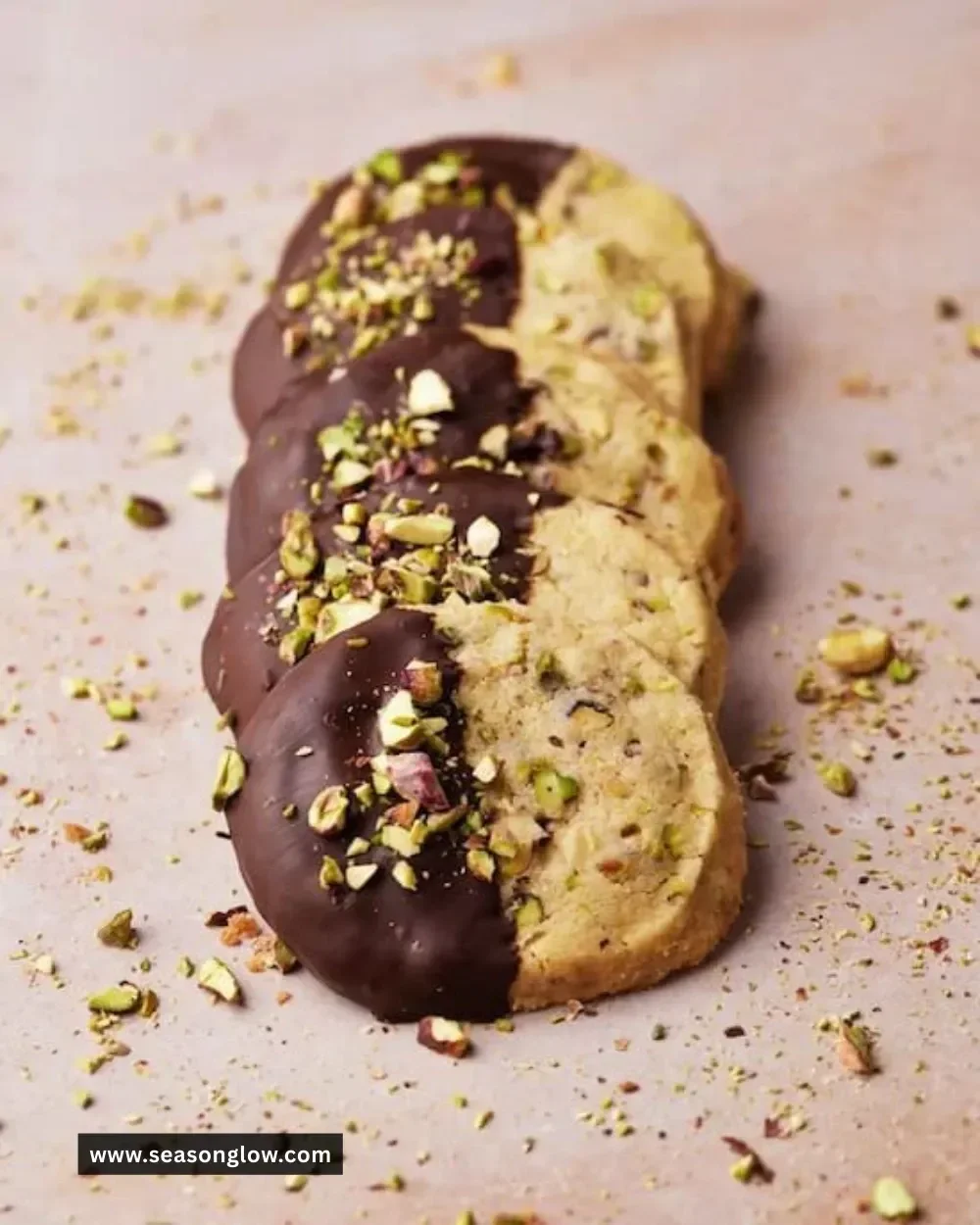 Pistachio shortbread cookies with a nutty green hue and a sprinkle of crushed pistachios.
