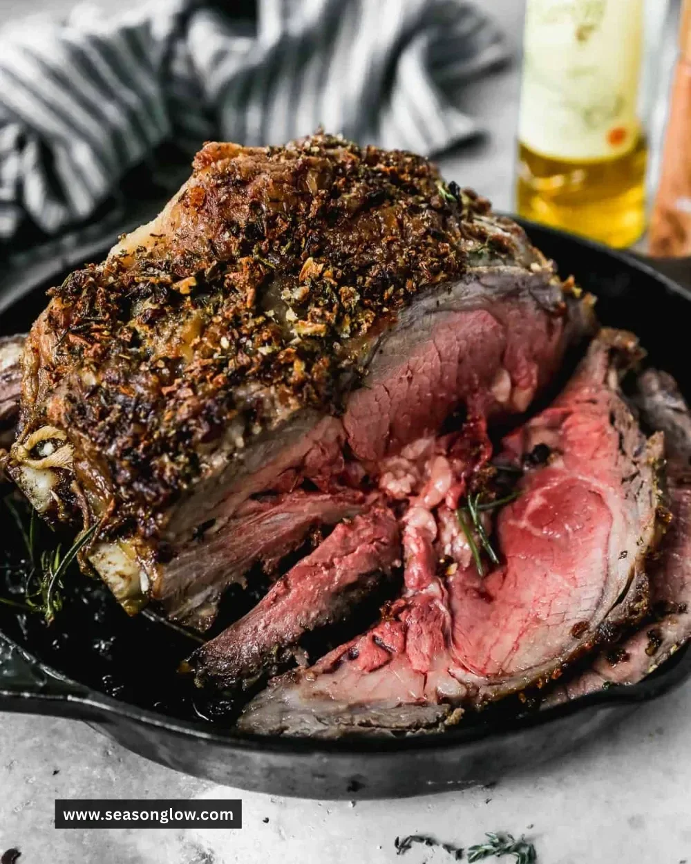 Perfectly cooked prime rib served with sides and garnishes.