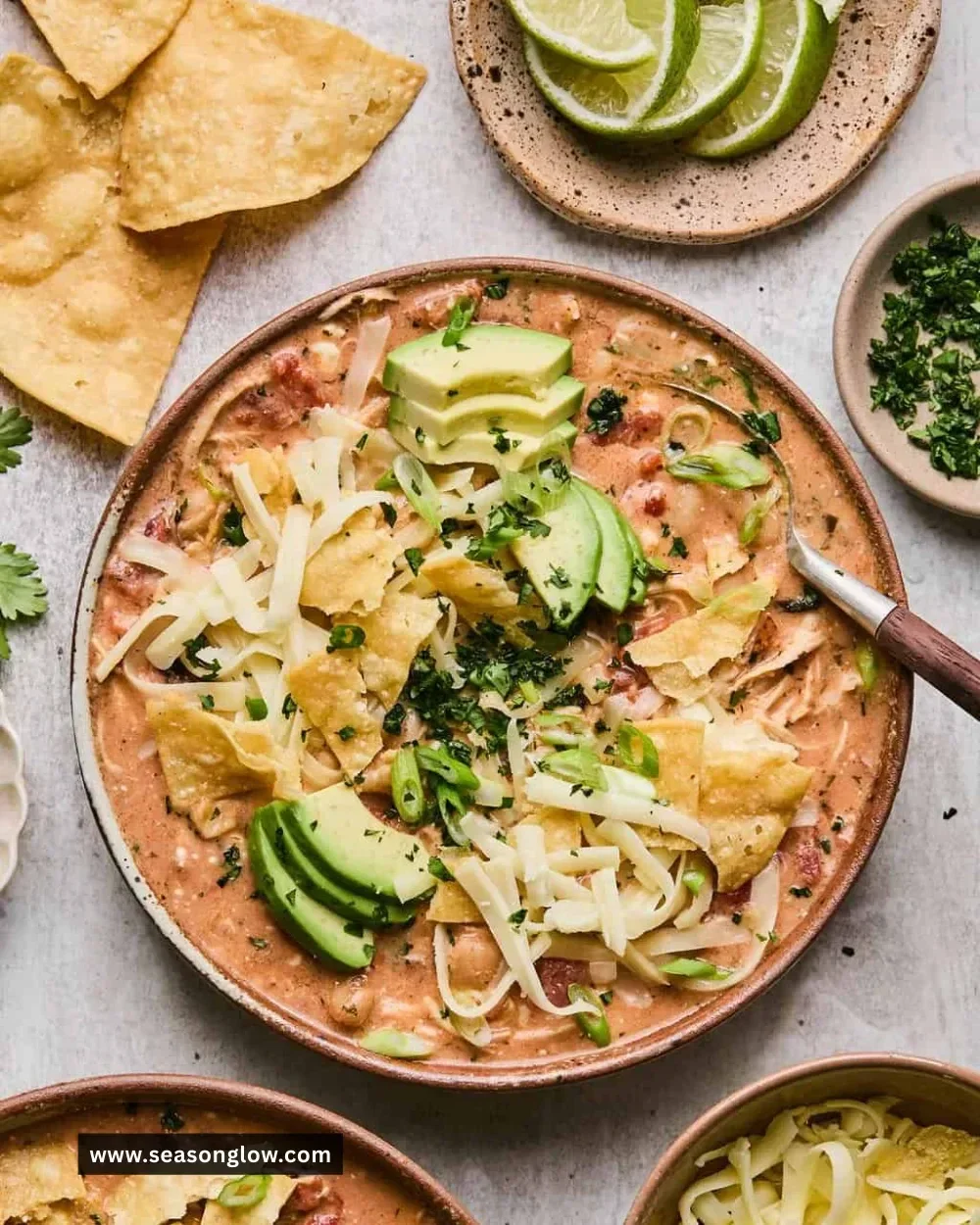 Bowl of slow cooker buffalo chicken chili topped with green onions