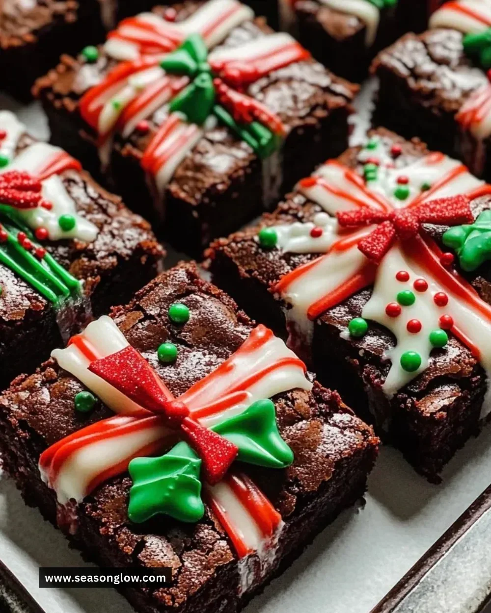 Decadent special occasion brownies freshly baked and topped with chocolate drizzle.