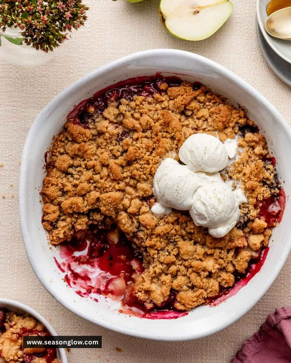Delicious spiced pear berry crumble dessert in a rustic dish